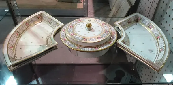 An English porcelain supper set, early 19th century, comprising; a central circular bowl and cover and four fan shaped dishes, each painted with a bor