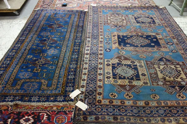 A blue Spartan rug, 240cm x 147cm, and a smaller blue Spartan rug, 196cm x 99cm, (2).