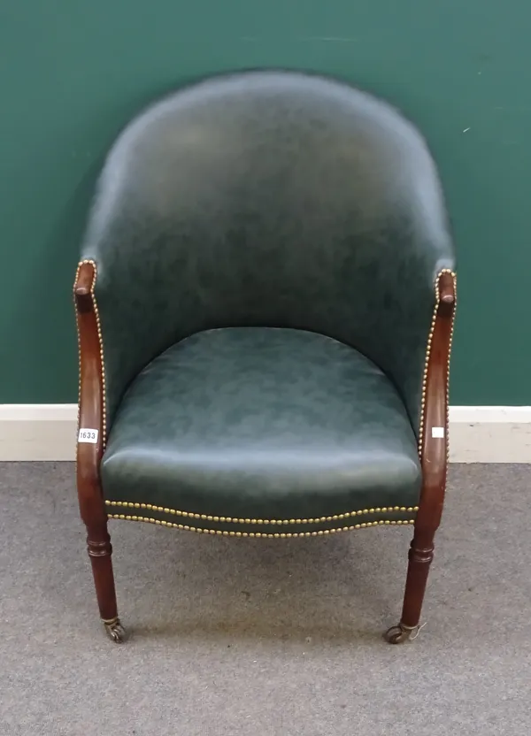 A 19th century mahogany tub bergere with brass studded green leather upholstery and serpentine seat on turned supports, 65cm wide x 87cm high.