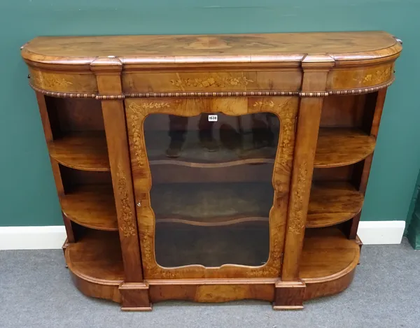 A Victorian walnut and floral marquetry inlaid credenza of 'D shaped outline, central glazed door within open shelves and plinth base, 149cm wide x 11