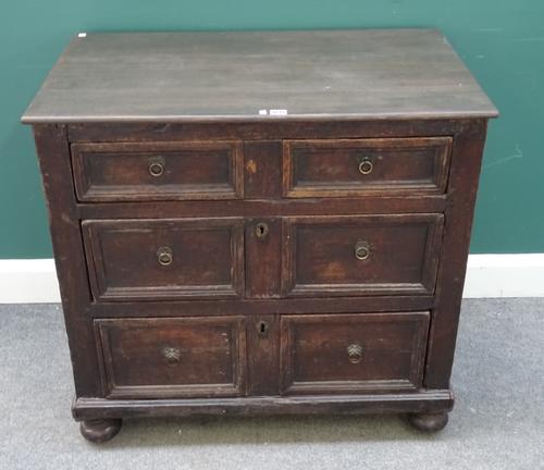 A Charles II and later oak chest of three long graduated moulded drawers, 89cm wide x 84cm high x 56cm deep.