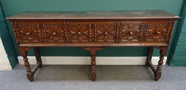 A Charles II and later oak dresser base, with three geometrically moulded frieze drawers, on baluster turned supports, 190cm wide x 87cm high x 49cm d