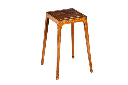 A George III tulip, rosewood and mahogany urn table, the frieze with pull-out slide, on tapering square supports, 38cm wide x 57cm high.  Illustrated