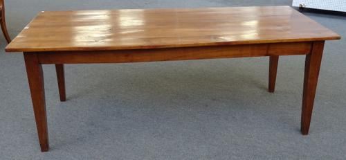A 19th century French cherry wood extending dining table, the plank top on tapering square supports, 85cm wide x 200cm long x 256cm extended x 76cm hi