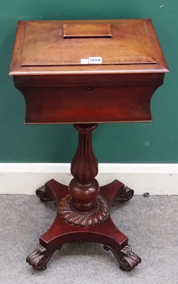 A late Regency mahogany teapoy, on a reeded baluster column, quatrefoil platform and four scroll supports, 40cm wide x 80cm high x 33cm deep.