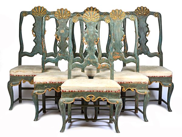 A set of six 19th century North Italian parcel gilt polychrome painted dining chairs, with shaped vase back and cabriole supports, 60cm wide x 125cm h