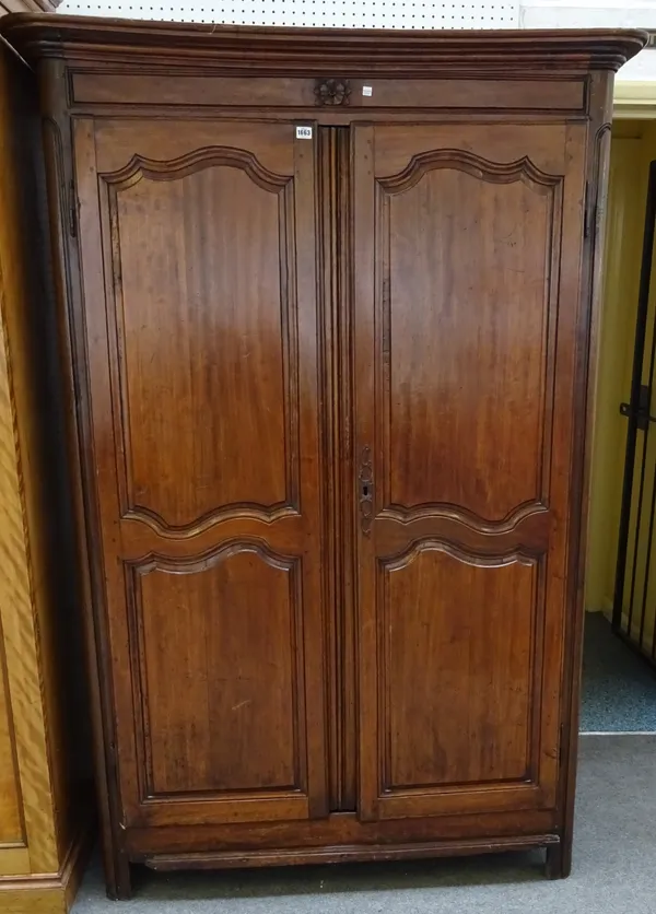An 18th century French chestnut two door armoire with arch panel doors, 130xm wide x 200cm high x 53cm deep.