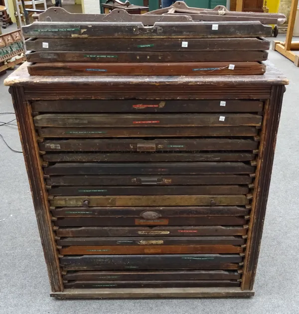 A late 19th century pine printers cabinet, containing twenty-two drawers, each with a large quantity of printers dyes, 96cm wide x 105cm high x 46cm d