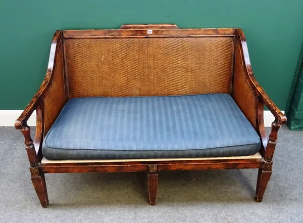 An 18th century plantation style hardwood framed sofa with rush back and sides on channeled tapering square supports. 130cm wide x 85cm high.