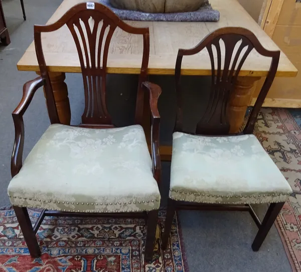 A set of twenty-two George III style mahogany dining chairs, with pierced splat and concave seat, on tapering square supports, to include a pair of ca