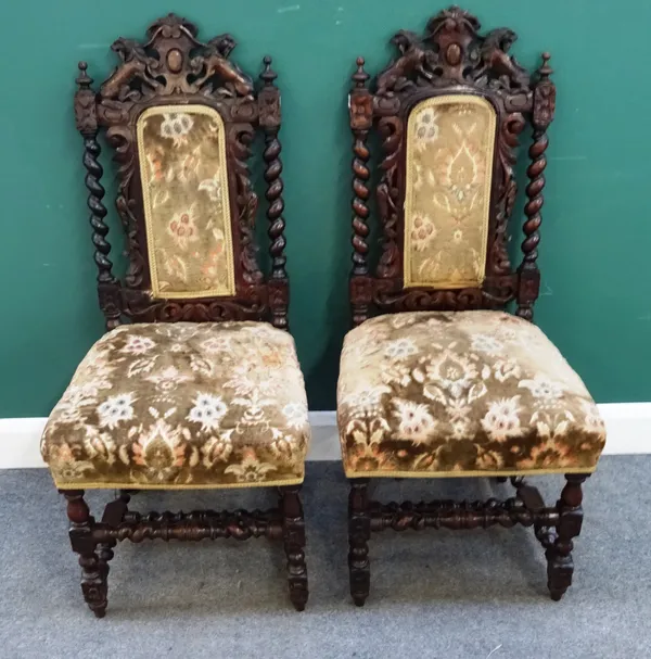 A set of six 17th century style carved oak dining chairs, with barley-twist supports, together with a similar matching pair, (8).