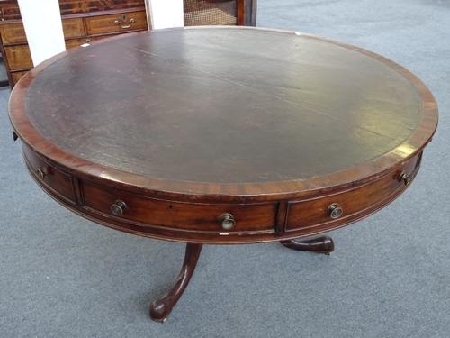 A George III mahogany drum table, with four true and four false frieze drawers, on later tripod base, 139cm deep x 78cm high.