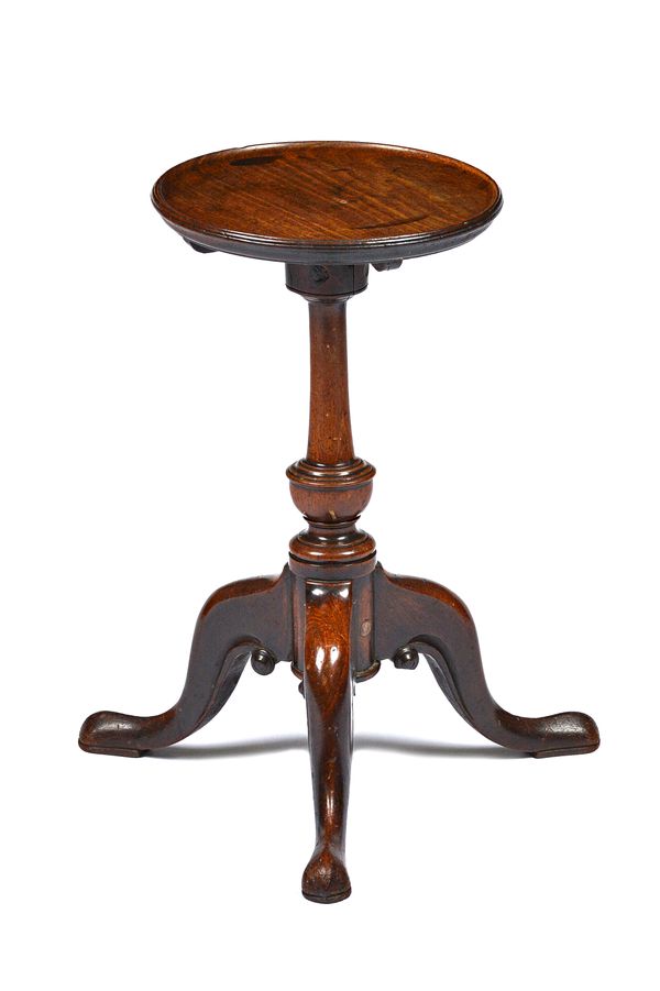 A George III mahogany kettle stand, the dished circular top on tripod base, the top 25cm wide x 47cm high. Illustrated