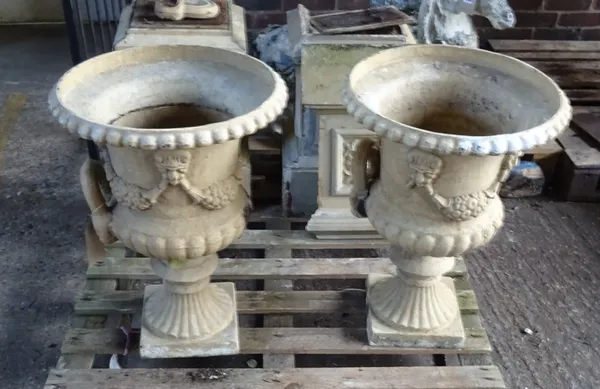 A pair of beige painted cast iron twin handled jardinieres, on stepped square bases, 50cm diameter x 114cm high.