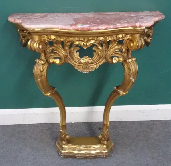 An 18th century style console table, the shaped marble top over a carved giltwood base, with a pair of scrolling supports, 83m wide x 34cm deep x 92cm