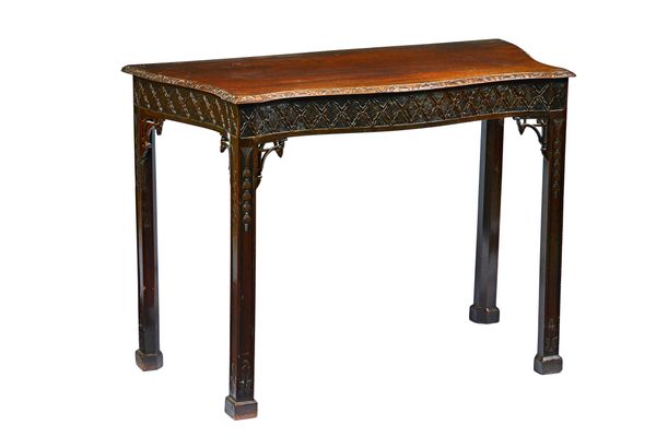 A mid-18th century style mahogany serving table, the serpentine top over carved frieze on canted square supports, 109cm wide x 78cm high x 52cm deep.