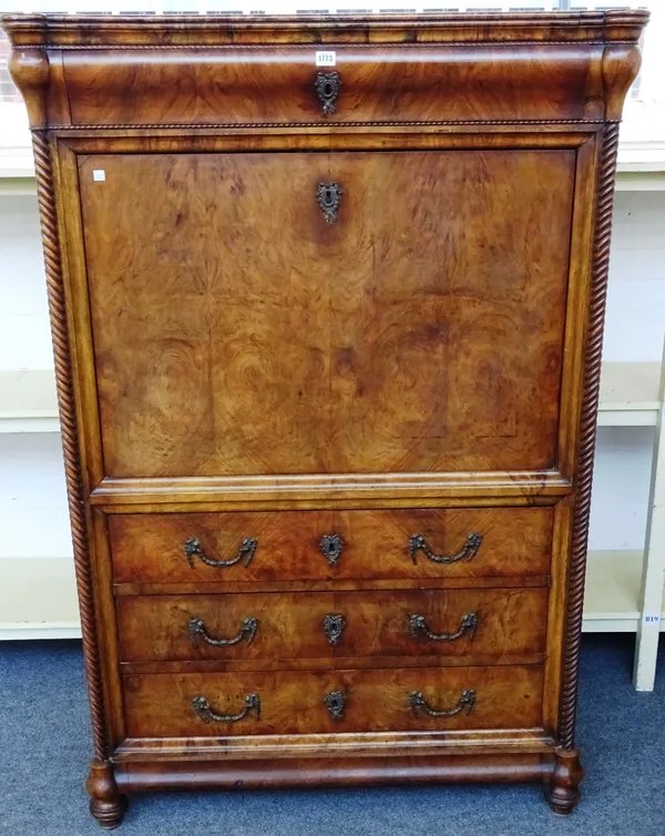 A 19th century Continental figured walnut secretaire a abattant, with fitted satinwood and tumbling block inlaid interior, flanked by split spiral flu