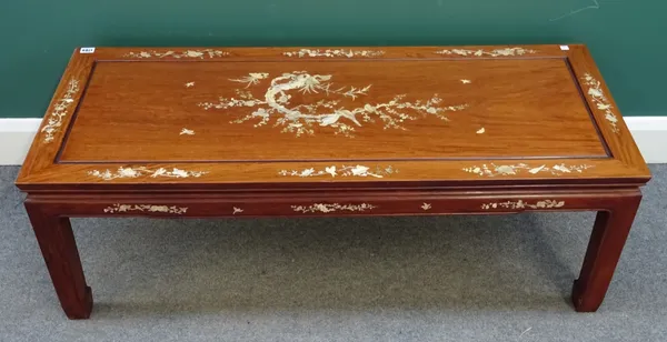 An early 20th century Eastern hardwood mother of pearl inlaid rectangular coffee table, on block supports, 122cm wide x 51cm deep x 41cm high.