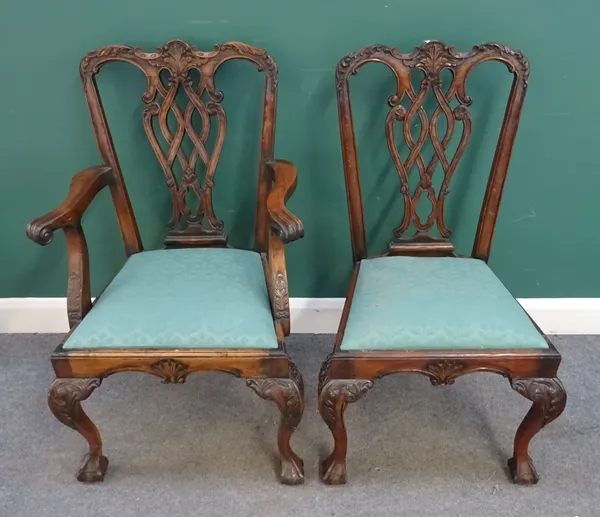 A set of ten mid-18th style hardwood dining chairs, each with interlaced splat on claw and ball feet, to include a pair of carvers, (10).