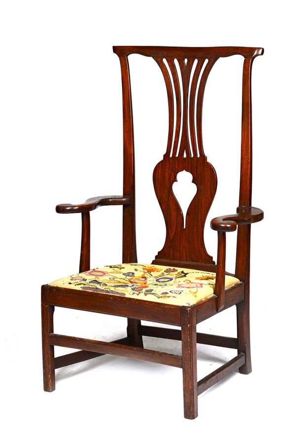 A mid-18th century provincial fruitwood and ash open armchair, the high back with pierced splat above drop-in seat, on canted block supports, 76cm wid