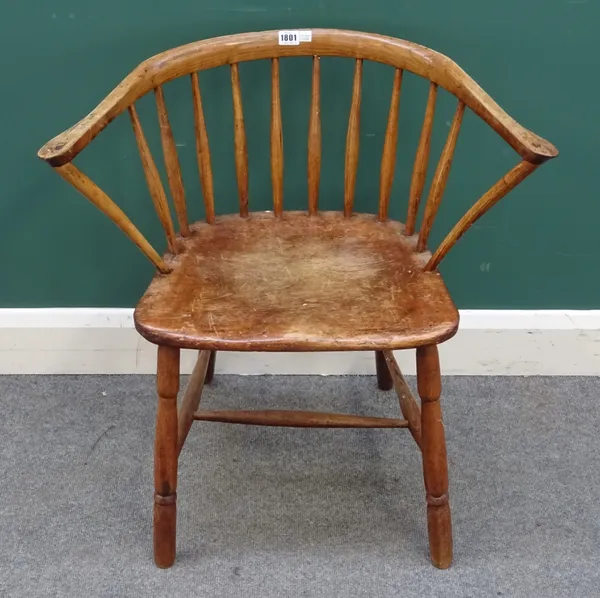 A late George III ash and elm low spindle back chair, with solid seat and turned supports, 69cm wide x 72cm high.