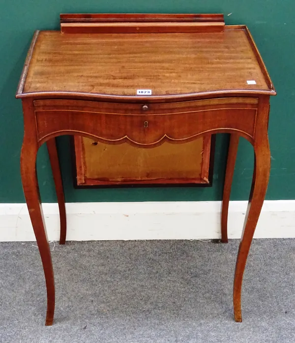 A George III mahogany lady's writing table, the integral pop-up screen over brushing slide and side frieze drawer, 60cm wide x 77cm high x 42cm deep.