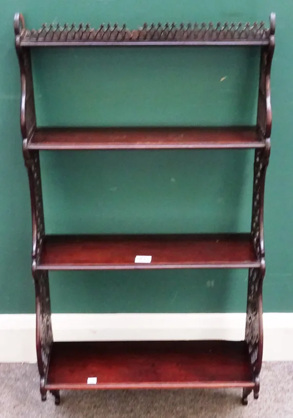 A set of George III mahogany three tier hanging shelves, with pierced fret sides, 47cm wide x 91cm high.