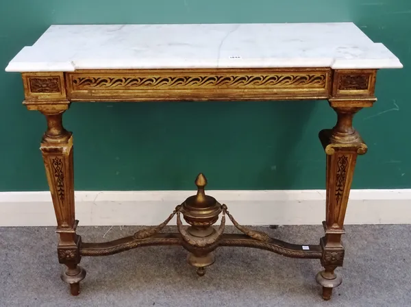 An Italian Renaissance style white marble topped giltwood table, the stepped rectangular top above a black scroll work painted frieze and tapering sup