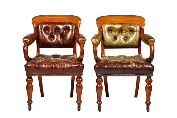 John Taylor & Sons, Edinburgh; a pair of early Victorian walnut framed leather upholstered open armchairs, on baluster turned supports, stamped to rai