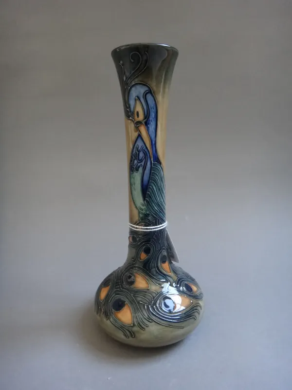 A Moorcroft 'Peacock' bottle neck vase, circa 1996, tube line decorated against a mottled green ground, printed and painted marks, 20cm high.