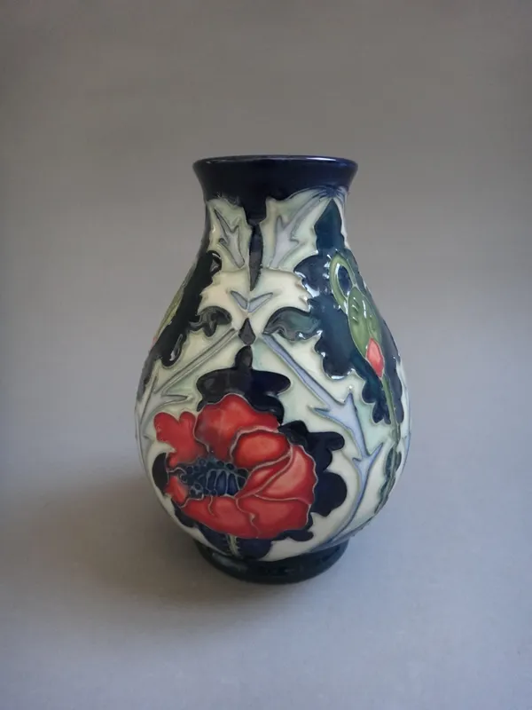 A Moorcroft 'Poppy' vase, circa 1996, by Rachel Bishop, tube line decorated with poppies and thistles against a blue ground, printed and painted marks