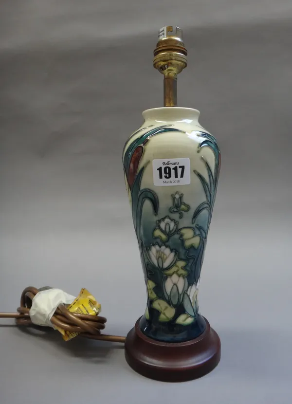 A Moorcroft 'Bullrush' table lamp, circa 1998, tube line decorated against a yellow ground, on a turned wooden base, 23cm high excluding fitment.