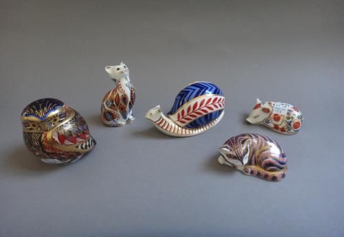 Five Royal Crown Derby Imari paperweights, each with a gold button to the base, comprising; a snail, two cats, an owl and a piglet, (5).