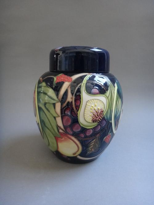 A Moorcroft 'Queen's Choice' pattern ginger jar and cover, by Emma Bossons, circa 2000, tube line decorated against a cobalt blue ground, impressed an