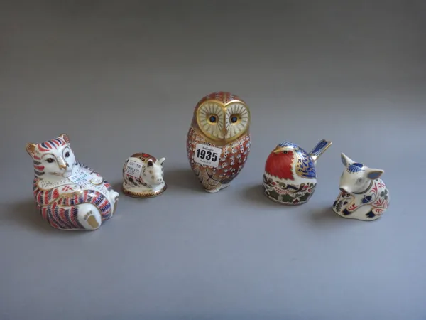 Three Royal Crown Derby Imari paperweights with a gold button to the base, and two further lacking gold button, comprising; a bear cub, two pigs, an o