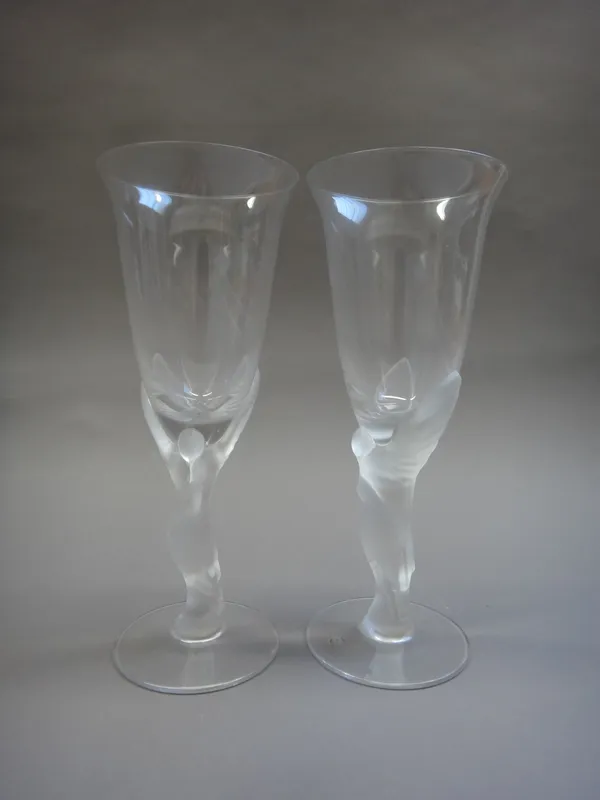 A set of twelve Faberge clear and frosted crystal champagne flutes, 25cm high, and eight matching wine glasses, 21cm high, all boxed, (20).