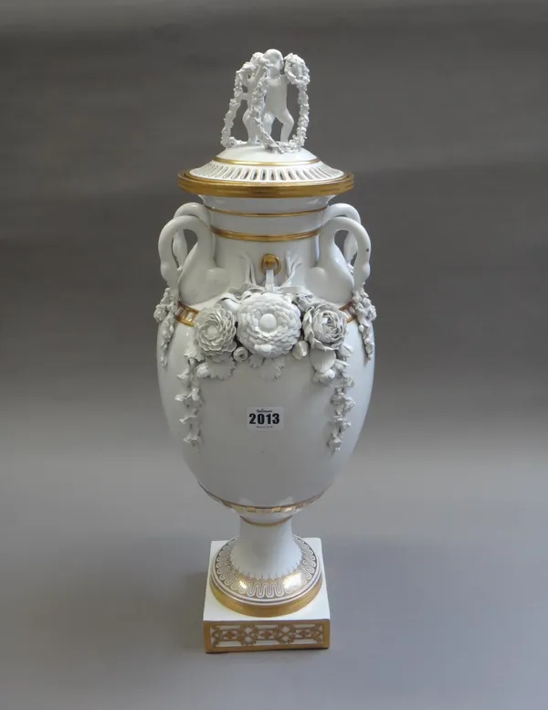 A Copenhagen porcelain vase and pierced cover, late 19th/early 20th century, with moulded swan handles suspending floral garlands and flanking further