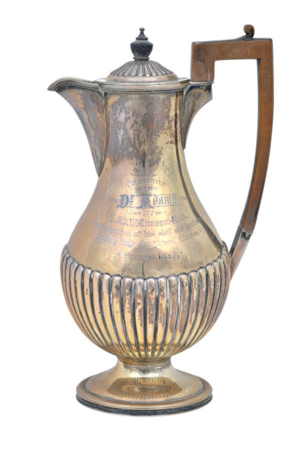 A late Victorian silver hot water jug, of baluster form, with partly fluted decoration and with wooden fittings to the handle and to the finial, Sheff