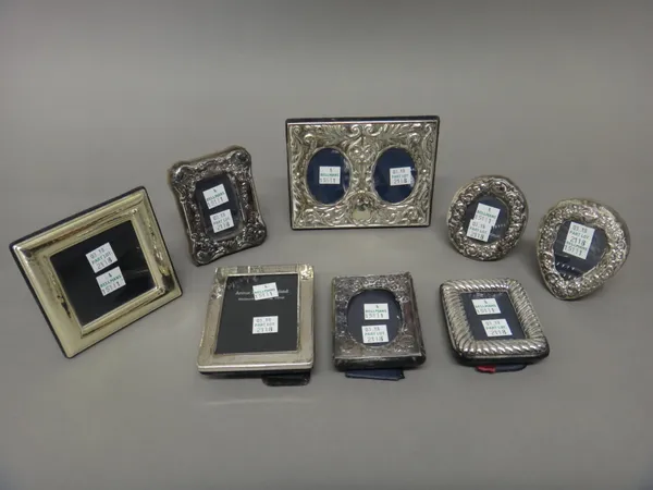 Seven silver mounted photograph frames, in a variety of designs and another square photograph frame, (8).