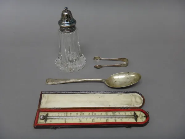 A silver tablespoon, Sheffield 1955 and a pair of silver sugar tongs, Sheffield 1908, combined weight 95 gms, a silver plated metal mounted glass suga