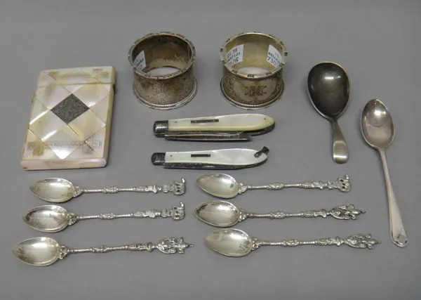 Silver and silver mounted wares, comprising; a pair of napkin rings, with engraved decoration, Birmingham 1908, a mother of pearl visiting card case,