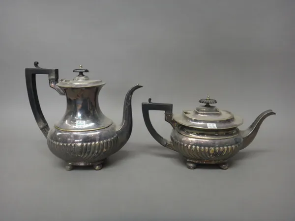 A silver milk jug, of oval form with semi-spiral fluted decoration, London 1908, weight 169 gms and a plated four piece tea and coffee set, comprising