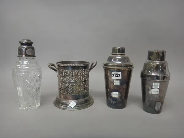 Plated wares, comprising; two cocktail shakers, a faceted glass cocktail shaker and a twin handled soda syphon stand, having pierced decoration, (4).