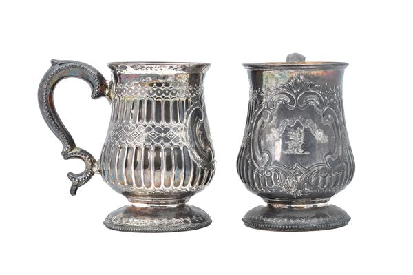 A pair of Victorian Irish silver mugs, each of baluster form, with semi-fluted and engraved decoration and with a beaded scrolling handle, raised on a