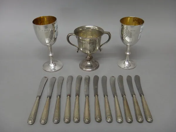 Two Victorian silver trophy goblets, both presentation inscribed, London 1892 and 1893, a silver twin handled trophy cup, presentation inscribed, Birm