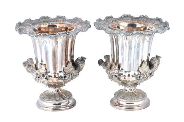 A pair of plated twin handled wine coolers, each of rustic form, the handles formed as sections of fruiting vine beneath shaped rims and having drop i