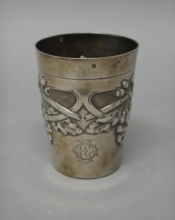 A French beaker, of tapering cylindrical form, decorated with a band of oak leaves and acorns, detailed Piault.Linzeler, height 9.5cm.