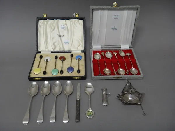 A set of six silver gilt and vary coloured enamelled coffee spoons, having coffee bean finials to the handles, Birmingham 1964, cased, a set of six Au