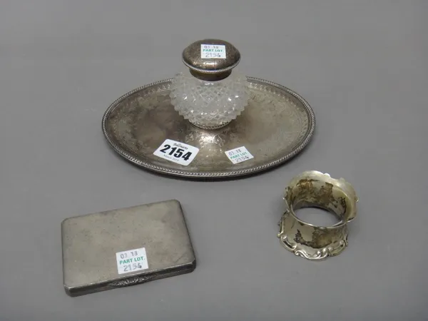 Silver, comprising; a Victorian oval inkstand, with foliate and scroll engraved decoration, within a beaded border, fitted with a silver mounted facet