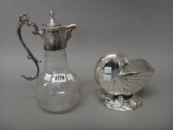 A silver plated metal mounted glass claret jug, the spout formed as a Bacchus mask, the handle with a swan's head finial and a plated hinge lidded spo